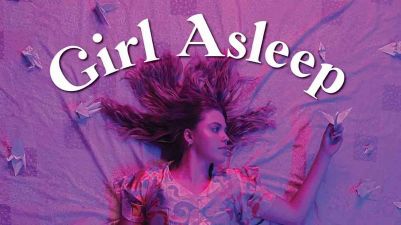 Girl lying on purple sheet underneath title Girl Asleep