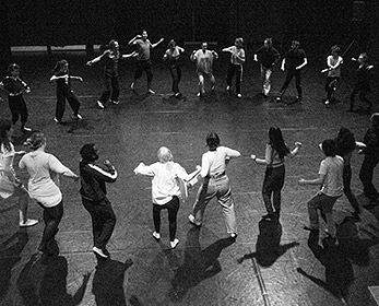 Group of performers standing in a circle